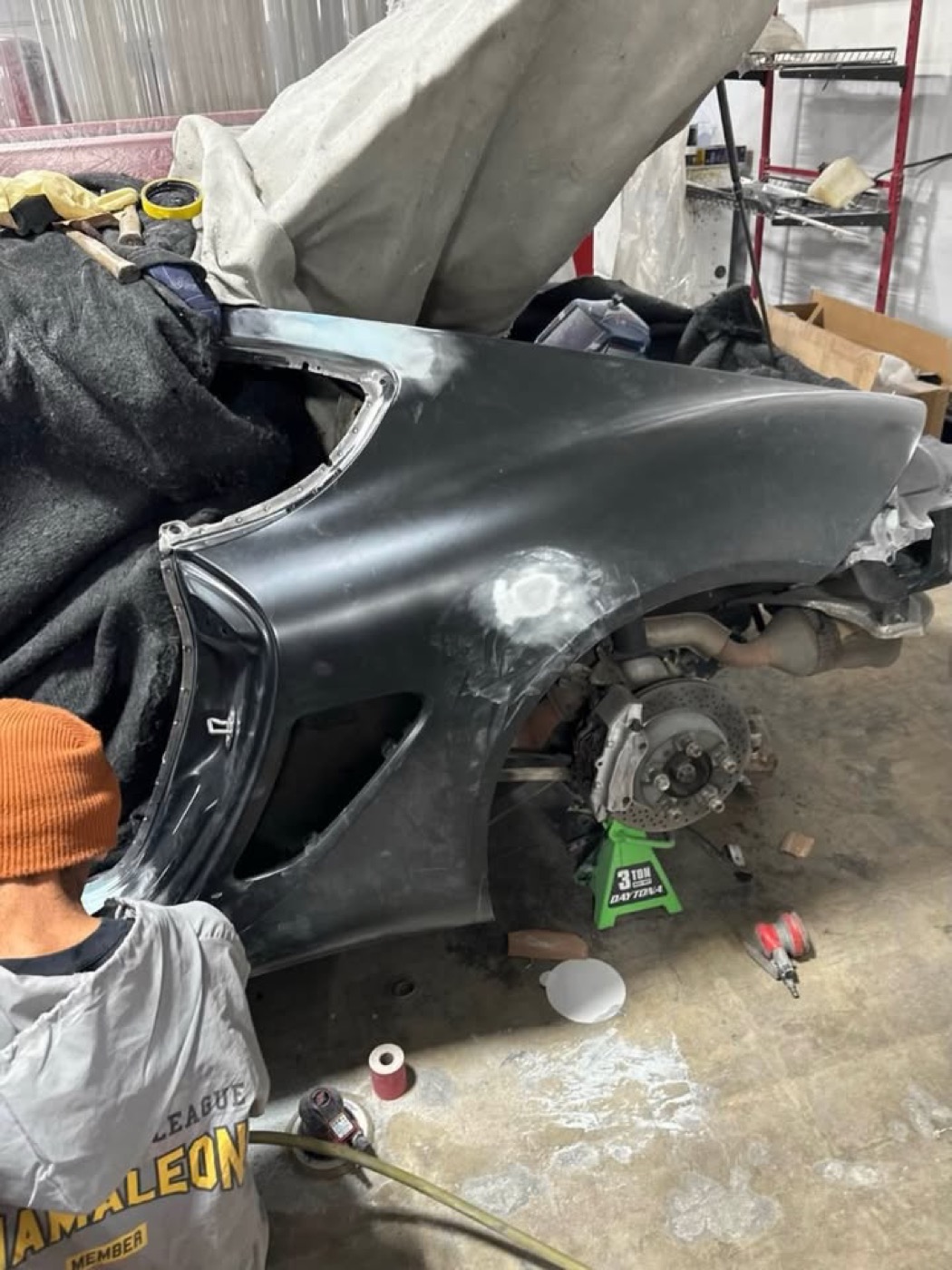 Before repair: Porsche Cayman — quarter panel
